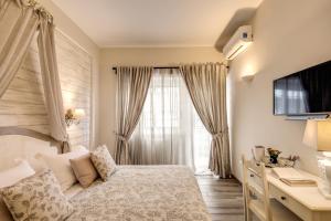 Postel nebo postele na pokoji v ubytování Casa Mia Vaticano Guest House