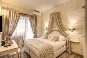 Postel nebo postele na pokoji v ubytování Casa Mia Vaticano Guest House