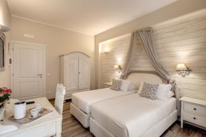 Postel nebo postele na pokoji v ubytování Casa Mia Vaticano Guest House