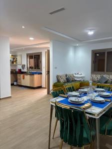a living room with a table and a couch at Marinamer 1 in Saïdia