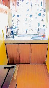 a kitchen with a sink and a window at Tranquil stays - 1 modern 1 bedroom apartment along Kandunyi Highway in Longonot
