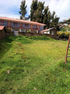 a large yard in front of a building at Hospedaje jatari in Estanciasuyo