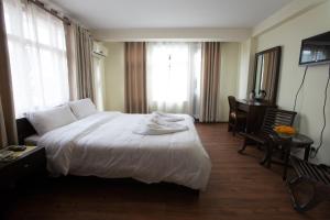 Ένα ή περισσότερα κρεβάτια σε δωμάτιο στο Hotel Yambu kathmandu