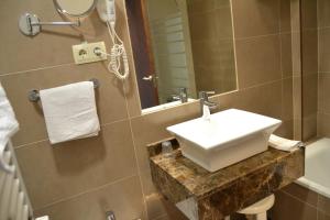 Un baño de Hotel Apartamentos Don Juan I