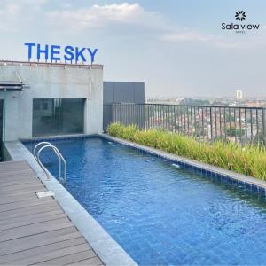 a swimming pool on the side of a building at Sala View Hotel in Solo