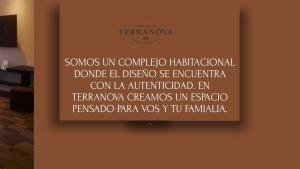 a sign on a wall with writing on it at Complejo Terranova in Aimogasta +2 photos