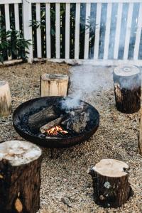 a grill with a bird on top at Treehouse Southern Highlands in Moss Vale
