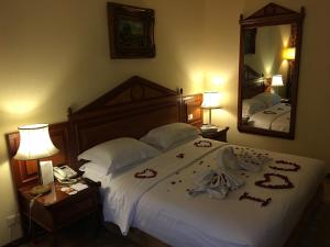 Voodi või voodid majutusasutuse Serenada Golden Palace - Boutique Hotel toas