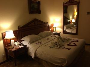 Voodi või voodid majutusasutuse Serenada Golden Palace - Boutique Hotel toas