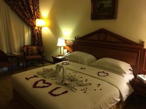 Voodi või voodid majutusasutuse Serenada Golden Palace - Boutique Hotel toas
