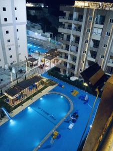 an overhead view of a swimming pool at night at Biu Bela abartment hotel in El Alamein +39 photos