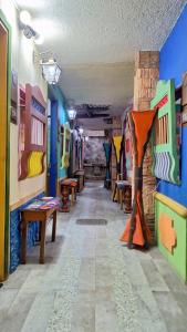 a room filled with lots of different colored walls at Hotel Atenas in Jericó