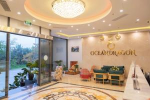 a lobby of an oceania hotel with a sign on the wall at ocean dragon in Ha Long