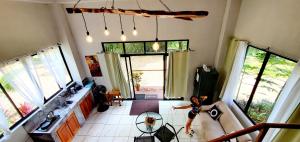 a woman is standing in a living room at Romantic Suite with Pool in Fortuna