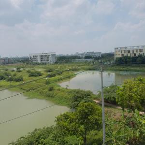 a view of a river with buildings in the background at Queen Hotel in Thạch Cầu
