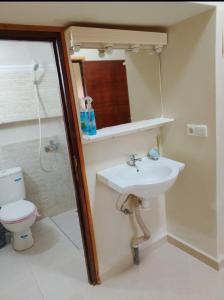 a bathroom with a sink and a toilet at Maison d'hôte Najah 1 in Khenifra