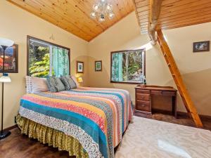 a bedroom with a bed and a wooden ceiling at Charming Tiny Cottage 5 min from National Park in Volcano