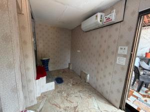 a room that is being remodeled with a wall at Swastik Guest House in Arambol