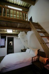 Postel nebo postele na pokoji v ubytování Qiong Lin 79 Hao Homestay