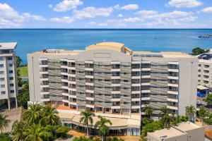 an aerial view of a building with the ocean in the background at Esplanade 88 in Darwin