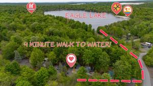 an overhead view of a road with signs on it at The Cranny Tiny Home Fire Pit Close to Lake in Maple Lake