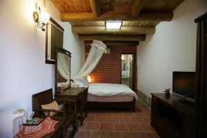 Postel nebo postele na pokoji v ubytování Qiong Lin 79 Hao Homestay