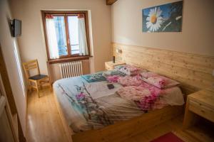 Postel nebo postele na pokoji v ubytování Albergo K2
