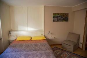 Postel nebo postele na pokoji v ubytování Albergo K2