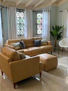 a living room with a couch and a table at Soulful Serenity in Steer Town