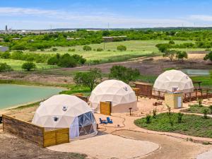 an overhead view of three domed tents in a field at Stargazer Dome Retreat in San Marcos