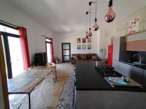 a kitchen with a wooden counter top in a room at cardo village in Bastia