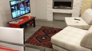 TV o dispositivi per l'intrattenimento presso Appartamento Caffarella