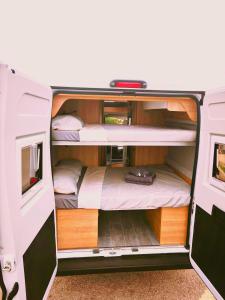 an interior view of an rv with two bunk beds at Menorca van life in Ciutadella