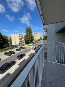 a balcony with a view of a parking lot at S14 Apartment in Vilnius