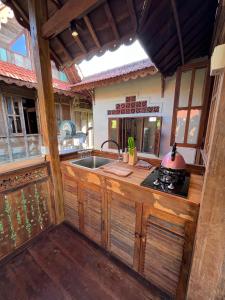 an outdoor kitchen with a sink and a stove at Green labak 2 in Silebeng