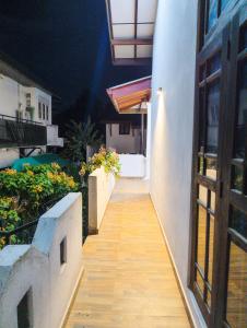 an empty balcony of a building with a wooden floor at Antica 91 Villa in Galle +71 photos
