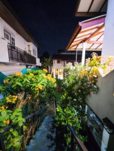 a balcony with flowers on the side of a building at Antica 91 Villa in Galle