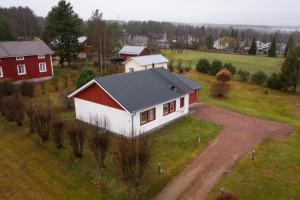an aerial view of a red and white house at Vasko Luxurious Suites, Firefox in Rovaniemi