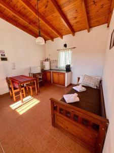 a living room with a couch and a table at Luna Vallista Apart Hotel in Seclantás