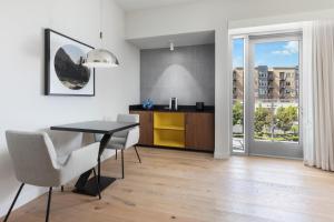 a kitchen and dining room with a table and chairs at Hyatt Centric Mountain View in Mountain View +82 photos