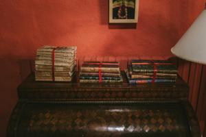 a pile of books sitting on top of a table at Caserio Otalora. S.XVIII in Orózqueta