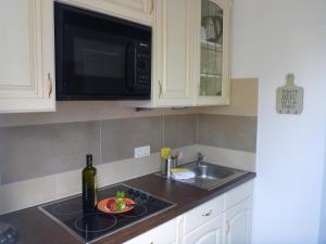 Η κουζίνα ή μικρή κουζίνα στο Ferienhaus Holst Sylt