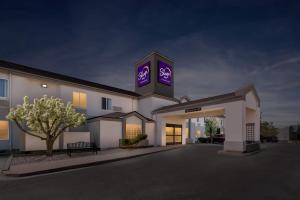 a large white building with a sign on it at Sleep Inn near Washington State Line in Post Falls