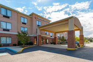 a rendering of a hotel with a building at Comfort Inn & Suites Cambridge in Cambridge