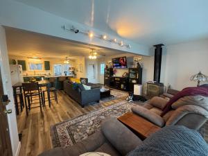 a living room with a couch and a table at Lakeview 4BR Huge Deck Dog Friendly ADA in Lakeside