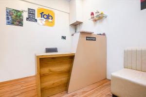 a room with a refrigerator and a sign on the wall at Via 24x7 in Mumbai +33 photos