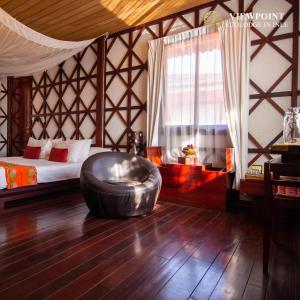 a room with a bed and a large metal ottoman at ViewPoint Ecolodge in Nyaungshwe Township +69 photos
