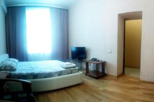 Säng eller sängar i ett rum på UKR Apartments on Independence Square