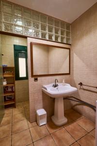 a bathroom with a sink and a mirror at FINCA VALDELAJARA a 20 minutos de Puy du Fou in Toledo +18 photos