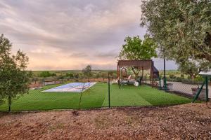 an image of a playground in a yard at FINCA VALDELAJARA a 20 minutos de Puy du Fou in Toledo